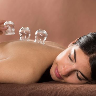 Cupping is a technique whereby a vacuum is created in a cup, drawing the skin up into the cup and se