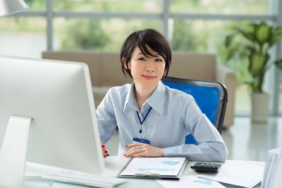 Professional person sitting at a desk
