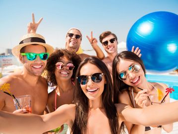 Group travel vacation. Group of people on vacation in a pool beach. Group travel agency. Arrow Sand