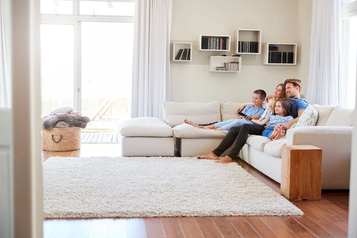 Family on couch enjoying clean house