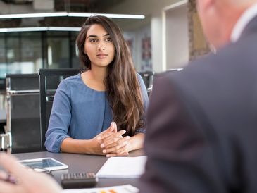young female talking with a lawyer