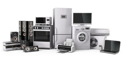 A display of various new white goods, including ovens, washing machines, and other appliances.