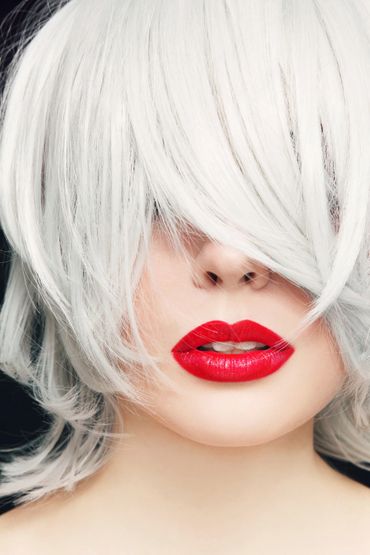 woman with platinum blonde hair and red lipstick 