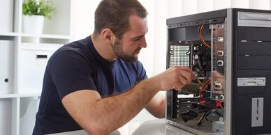 Local computer repair in Olympia - technician fixing a desktop computer