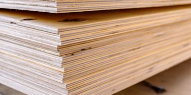 Finely stacked sheets of plywood.