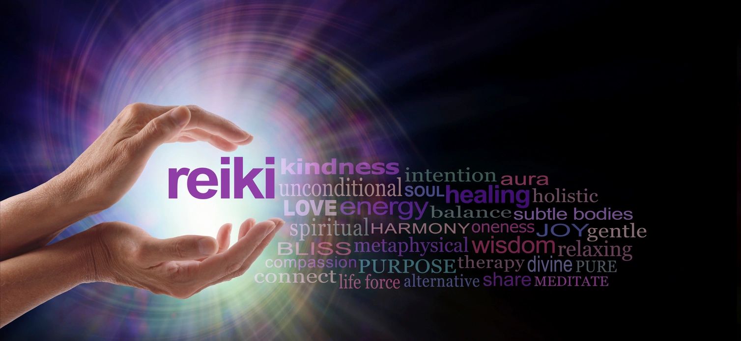 Picture of hands holding light and descriptive words related to Reiki.