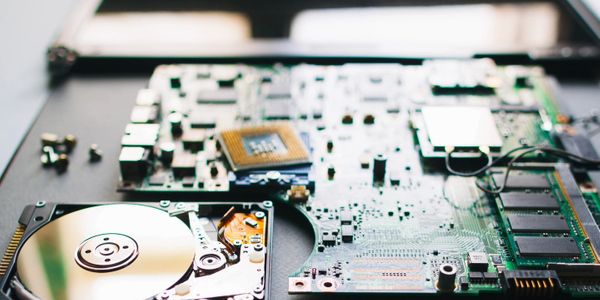 Laptop components organized on desk