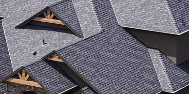 Overhead view of roof with grey shingles