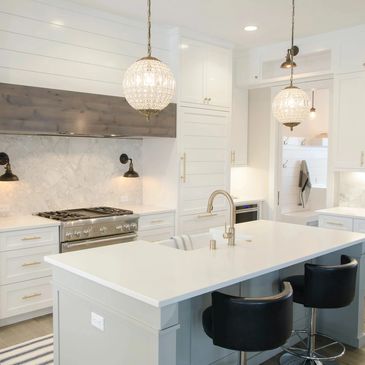 modern white kitchen with kitchen island and gold handles 