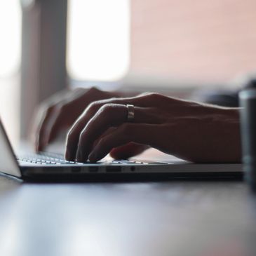 Photo of man working on laptop