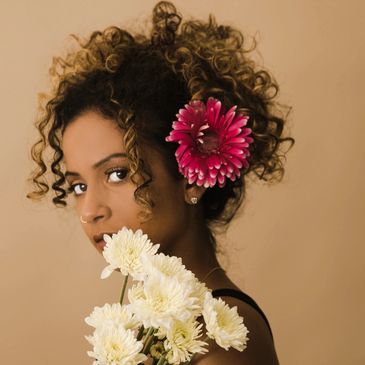 Close up shot of a lady with flowers in hair