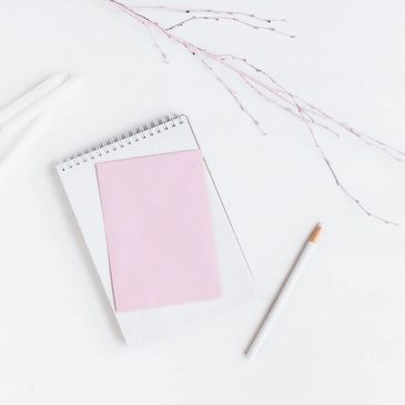 pink and white writing utensils
