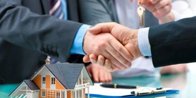 Photo of two men shaking hands in real estate deal