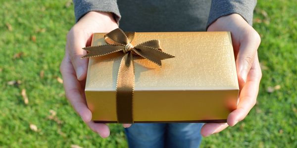 golden package with golden bow/ ribbon 