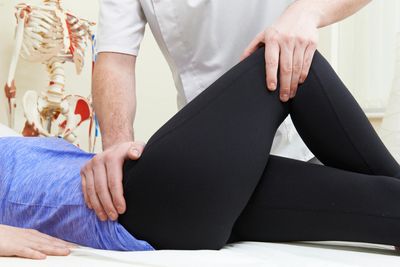 a woman's hip being treated