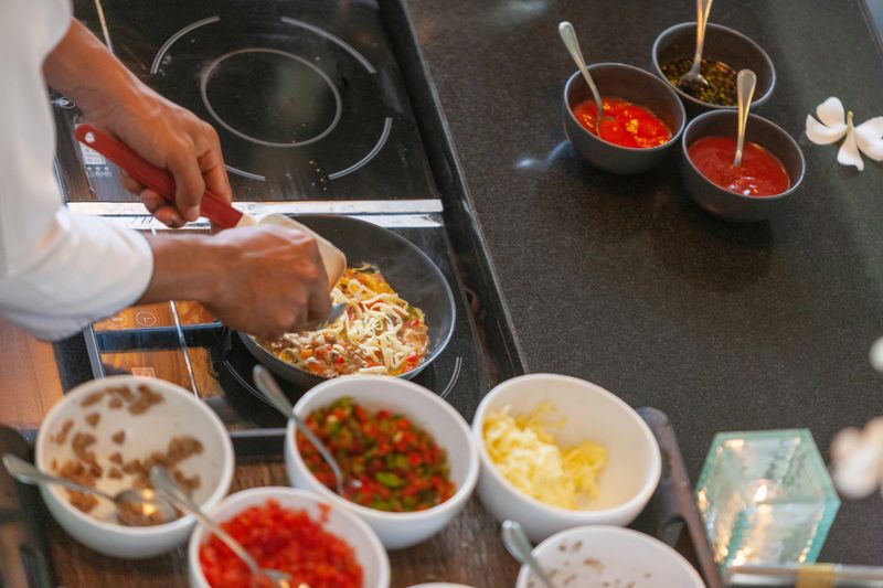 Elevated view of chef making scrambled eggs
