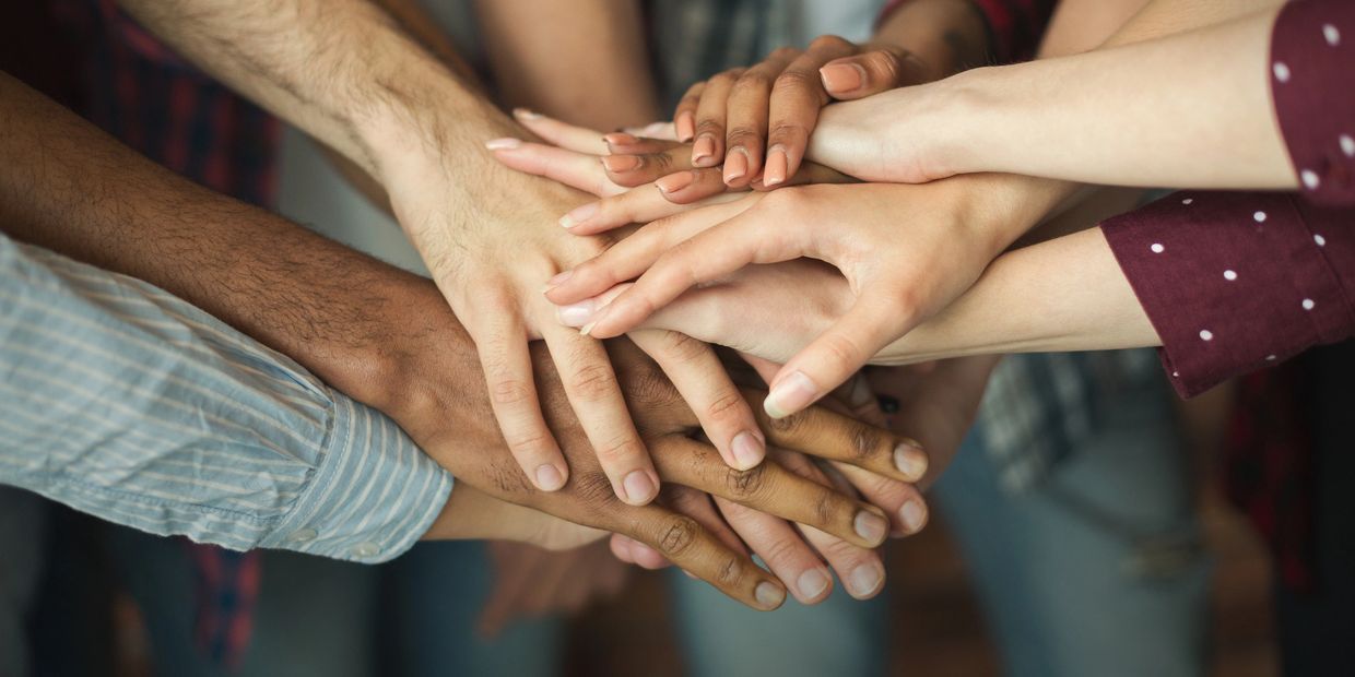 A group of hands in a circle