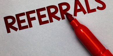 Word 'REFERRALS' written in red with a marker.