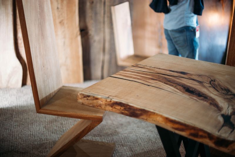 wooden table made of solid oak and ash. exclusive expensive furniture.