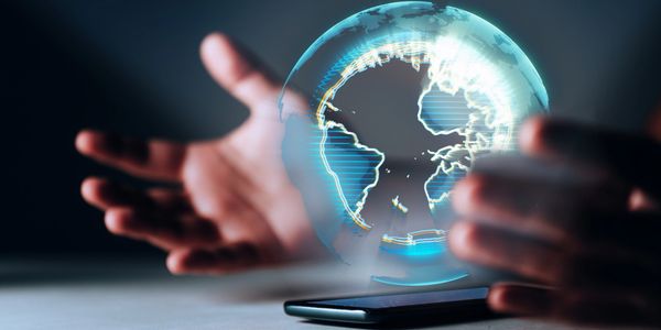 Holographic globe projection emerging from a smartphone.