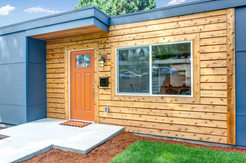 Nicely remodeled home exterior with wooden trim.