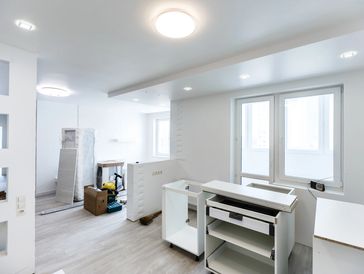 the interior of a room, likely a kitchen or a living space, in the final stages of renovation.