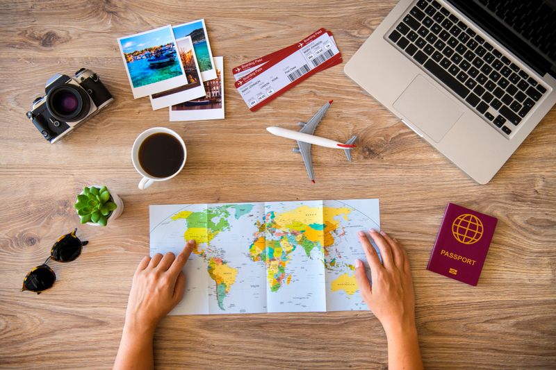 Woman looking a map for planning her travel.
