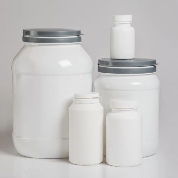 Various sizes of blank white plastic containers with lids on a white surface.