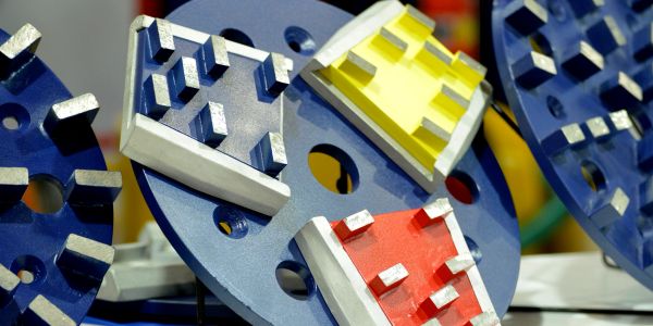Colorful mechanical components arranged on a blue circular base.