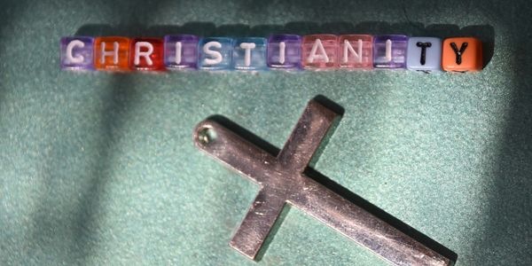 Beads spelling 'Christianity' with a cross pendant.