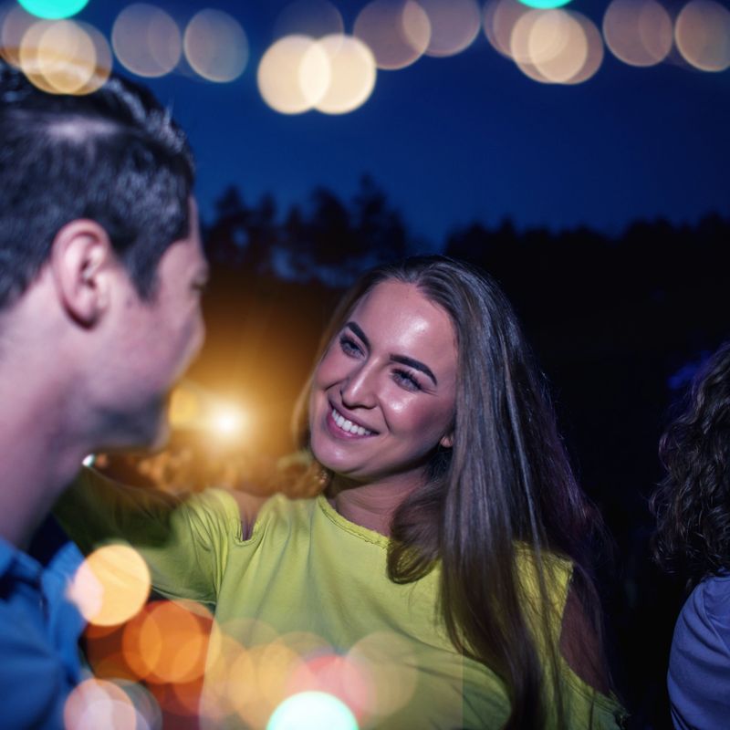Friends dancing at a concert