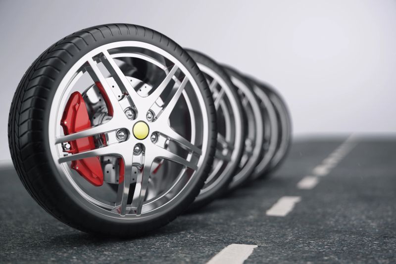 Car wheel, car tire standing on a road. Concept tyres. Car tire with a disc standing on the asphalt road, 3D illustration