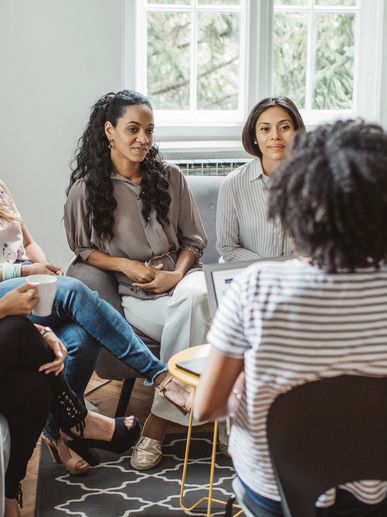 Group of women in a casual meeting indoors.