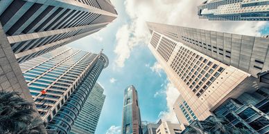 High-rise office towers looking up towards the blue sky