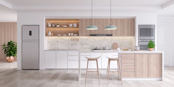 Modern kitchen with wooden cabinets, marble backsplash, and a central island with two stools.