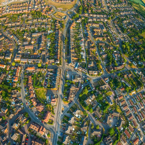 Aerial view of a suburban neighborhood with houses and streets.