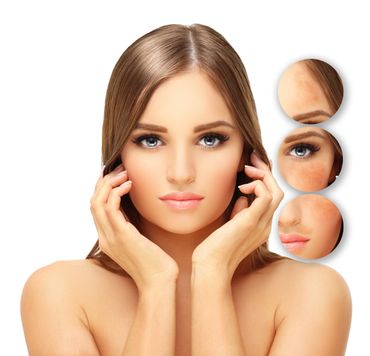 Close-up of a woman with flawless skin and makeup highlights.