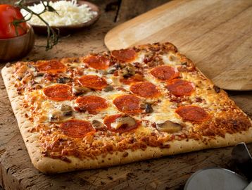 Thick, spongy pan baked topped with tomato sauce and mozzarella cheese 