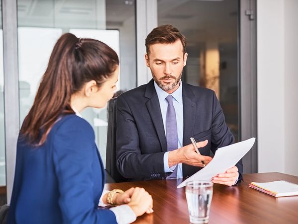 Man and woman talking at a table about US Niche Technology recruitment