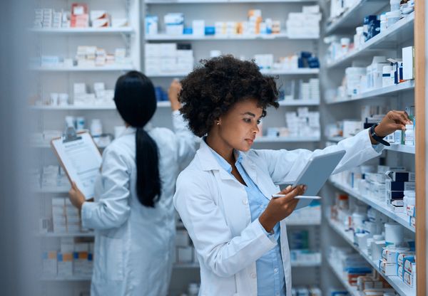 Two pharmacists working in a pharmacy.