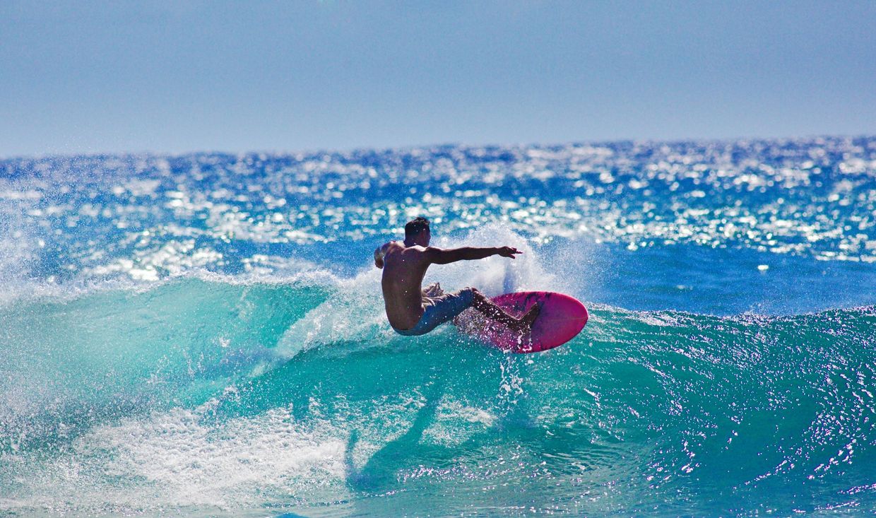 A Mentawai Surfer surfing and ripping the curl.