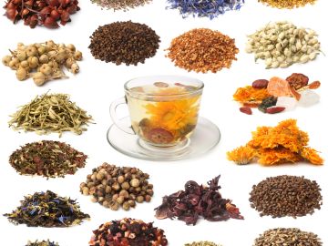 Various dried herbs and a cup of herbal tea.