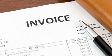 Close-up of an invoice with a pen.
