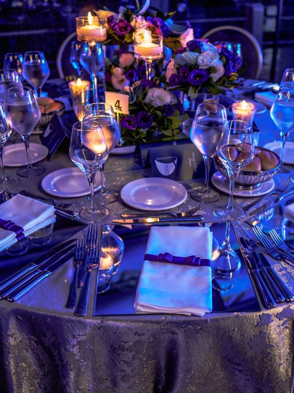 Elegant table setting with candles and flowers.