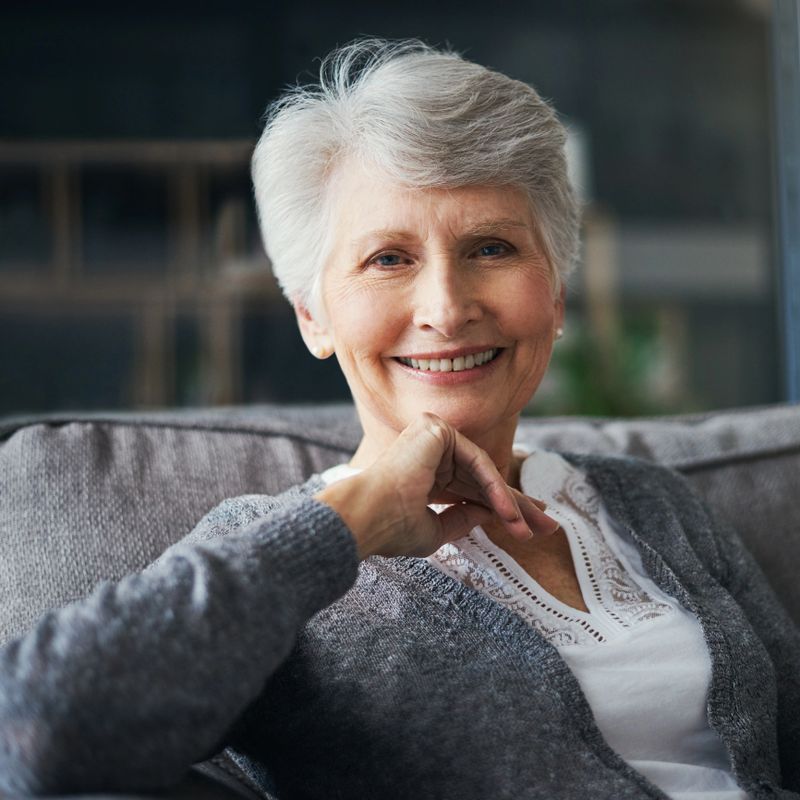 Portrait of a senior woman relaxing on the sofa at home