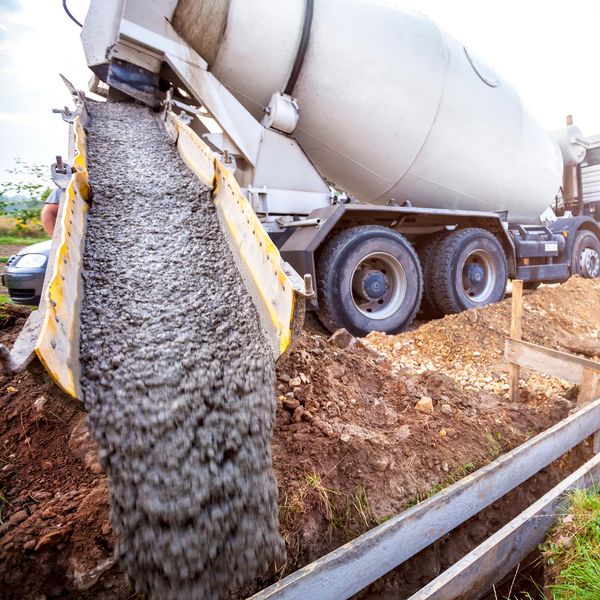 Uno Concrete truck pouring from a mixer truck at a construction site in charlotte 