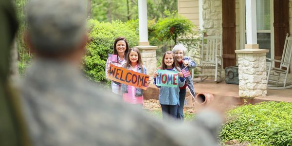 Supportive military home rental sign with porch.