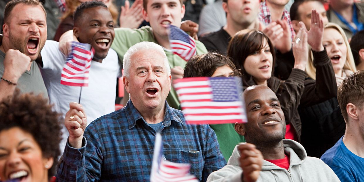 happy people taking the oath of citizenship 