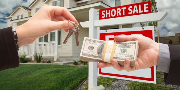 Exchanging cash for house keys during a short sale.