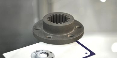Metal gear flange with internal teeth.